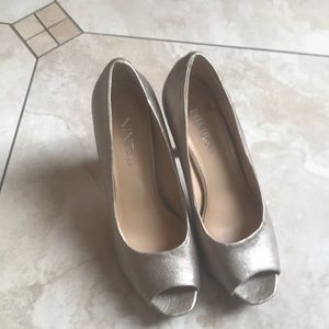 Gold open toe shoes
